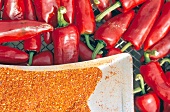 Close-up of chilli peppers and chilli powder