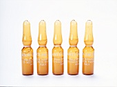 Anti-wrinkle ampoule on white background