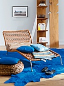 Liege leather lounger with cushions on blue coat