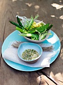 Salad with asparagus, onion sugar snap peas, broccoli on plate