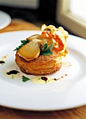 Close-up of potato cake with porcini mushroom on plate
