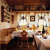 Rustic dining room with laid out table at mountain lodge