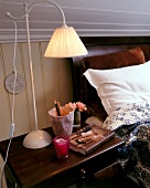 Rural style lamp on table beside bed