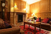 Sitting area with fireplace in hotel, France