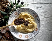 Spaghetti with olive tapenade on plate