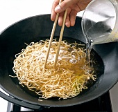 Water being poured in noodles , step 3