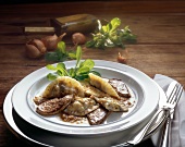 Mushroom pierogi with foie gras on plate