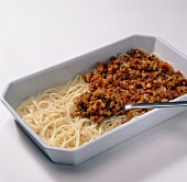 Spaghetti and sauce on tray