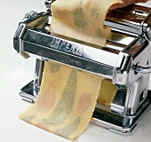 Dough strip rolled out of pasta machine