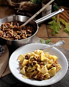 Pappardelle with hare sauce on plate with fork