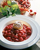 Berry compote with cream puff in bowl