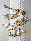 Different shaped nut kringle cookies on steel spatula