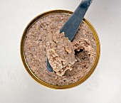 Homemade sausage liverwurst with piece on spatula, overhead view