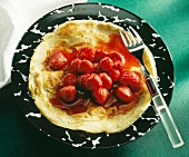 Pancakes with strawberry compote on plate