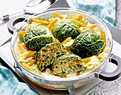 Savoy cabbage balls with green core of carrots and savoy cabbage in a pot