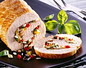Close-up of roast turkey roll stuffed with rice, peppers, onions and ham