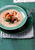 Beans soup with prawns in green bowl