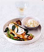 Baked Chicken with vegetables on plate and bowl of rice