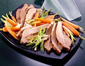 Marinated breast of veal with carrots, spring onions and ginger on plate