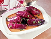 Beef wrapped in red cabbage in serving dish