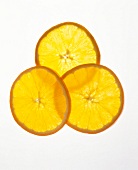 Thin slices of orange on white background