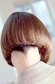 Rear view of woman with brown hair in bob cut