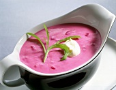 Horseradish sauce with bread and beetroot in serving dish