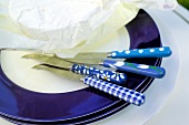 Close-up of place setting in blue