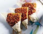 Triangle shaped florentine with sunflower seeds and coating of white chocolate