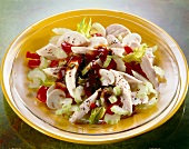 Close-up of chicken salad with celery, green peppers and mushrooms on plate