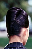 Rear view of dark haired woman with updo