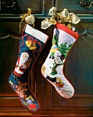 Christmas stockings embroidered with snow and Santa Claus