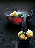 Chinese wonton soup in red bowl