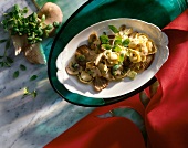 Noodles with oyster mushrooms and mushrooms on plate