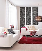 Living room in white with black and white ornamental wallpaper