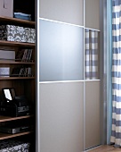 Cabinet in grey as screen with TV projector behind door
