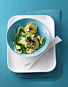 Vegetable mint spaghettini in blue bowl