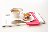 Tray with cup of coffee and muffin