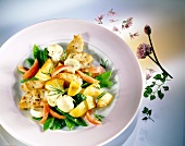 Fried potatoes with green peas, tomatoes, mushrooms and turkey breast on plate