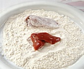Liver in flour on plate