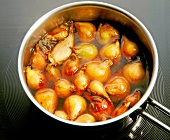 Close-up of onions being boiled in pan