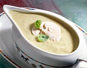 Close-up of mushroom sauce garnished with mushroom in serving bowl