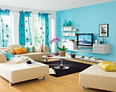 Interior of living room with turquoise wall, sofa, cushion, table and curtains