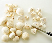 Cutting mushrooms into quarters