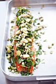 Salmon fillet with lemon grass and ginger pickle on baking tray