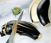 Cut eggplant in cubes with kitchen knife
