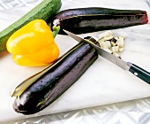 Dicing eggplant with knife for pork with ketchup marinade