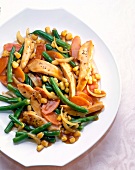 Chopped chicken with corn, beans, onions and carrots on dish