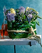 Bouquet of hyacinths and Lysimachus clethroides on table