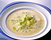 Cold soup with potatoes, leeks and chives in dish
